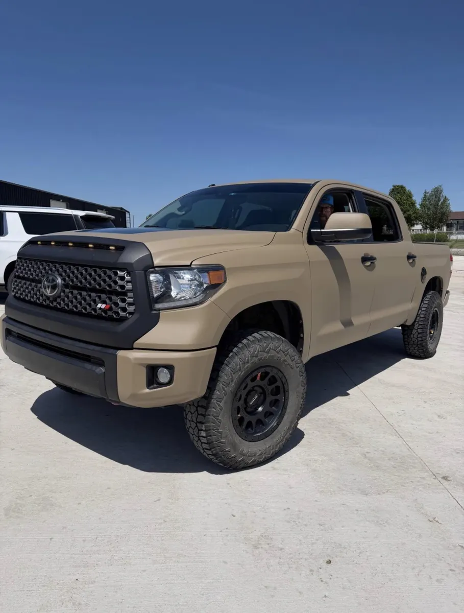 Tan Toyota Tundra outside the shop